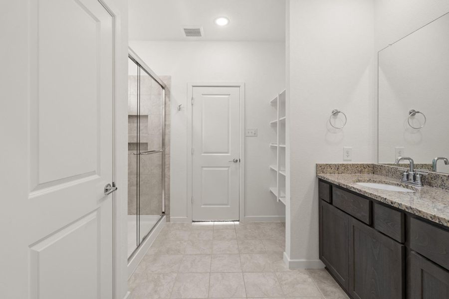 You'll love getting ready in this light and bright primary bathroom!