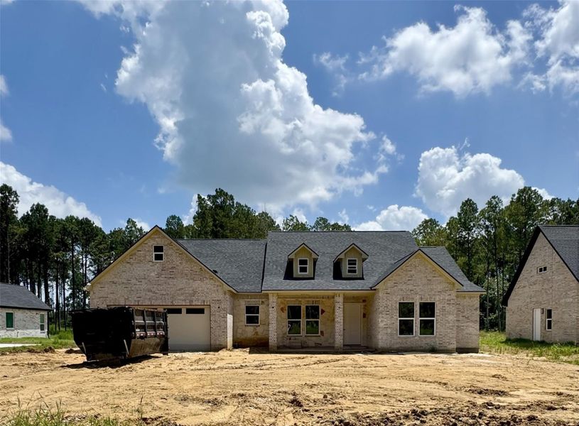 Front exterior of a new home in , Dayton, TX, highlighting curb appeal (Image 1). Front exterior of a new home in , Dayton, TX, highlighting curb appeal (Image 1).