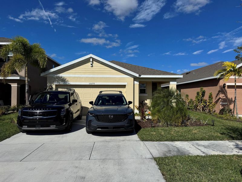 Front exterior of a new home in , Port St. Lucie, FL, highlighting curb appeal (Image 1). Front exterior of a new home in , Port St. Lucie, FL, highlighting curb appeal (Image 1).