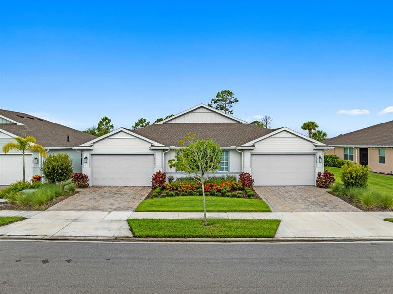 Front exterior of a new home in , Punta Gorda, FL, highlighting curb appeal (Image 21).