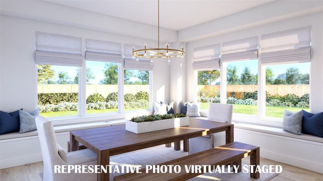 With windows everywhere you look, this dream dining room is the perfect place to host grand dinner parties or cozy family gatherings.  REPRESENTATIVE PHOTO VIRTUALLY STAGED