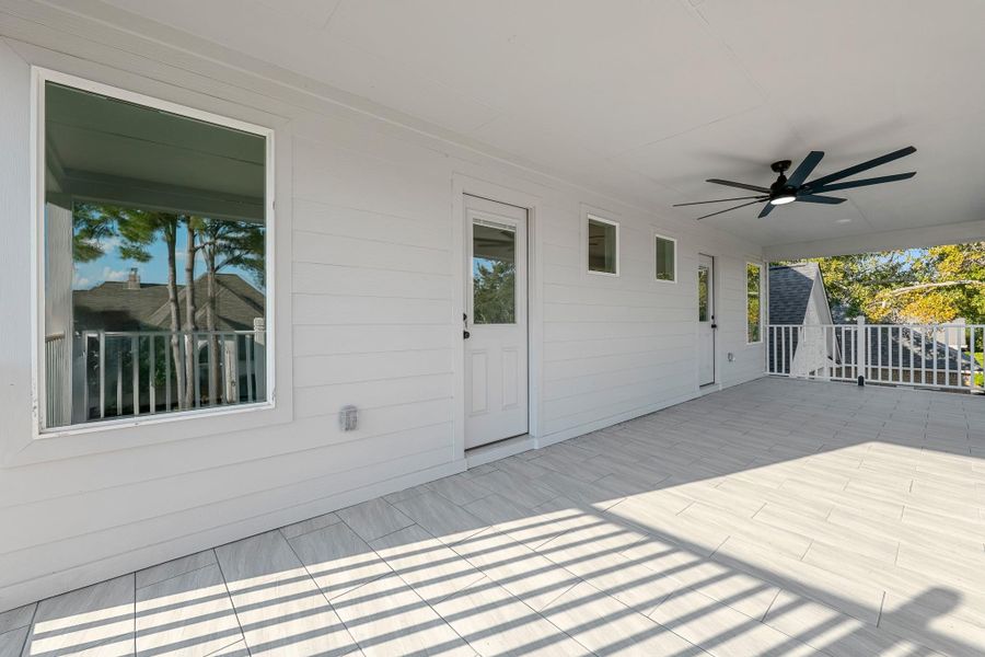 Stylish front porch with elegant tile flooring. Stylish front porch with elegant tile flooring.