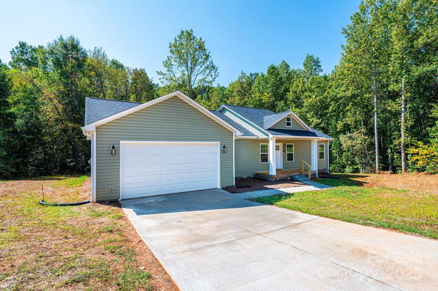 Front exterior of a new home in , Newton, NC, highlighting curb appeal (Image 17).