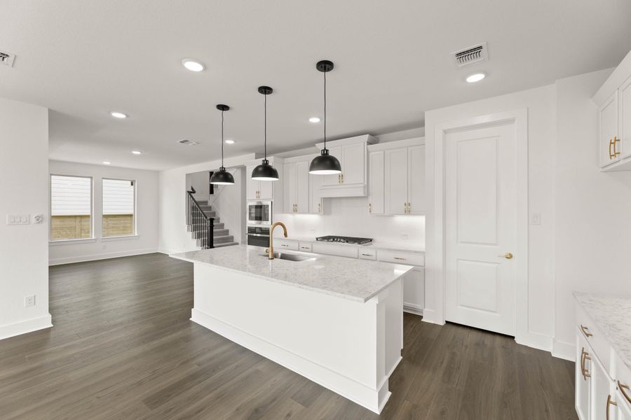 Representative furnished interior of a home built from the Laurel by Tri Pointe Homes in Treeline, Justin (Image 7).