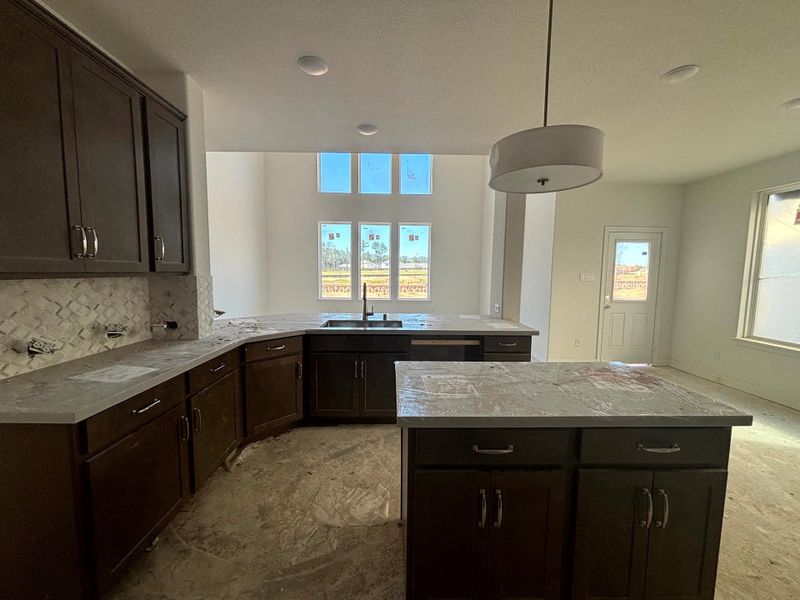 Construction progress - kitchen open to family room and dining area Construction progress - kitchen open to family room and dining area