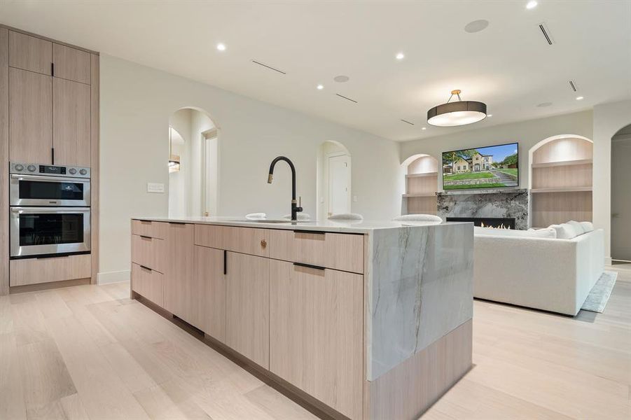 The countertops falls partly down the side of the island for a eclectic contemporary touch!