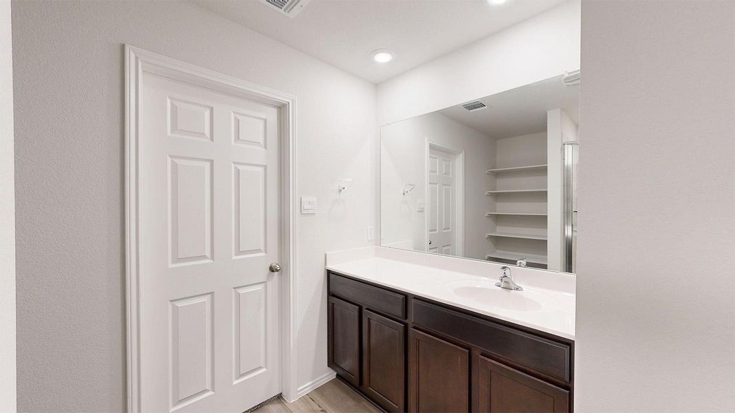 Bathroom with vanity and light wood-style flooring