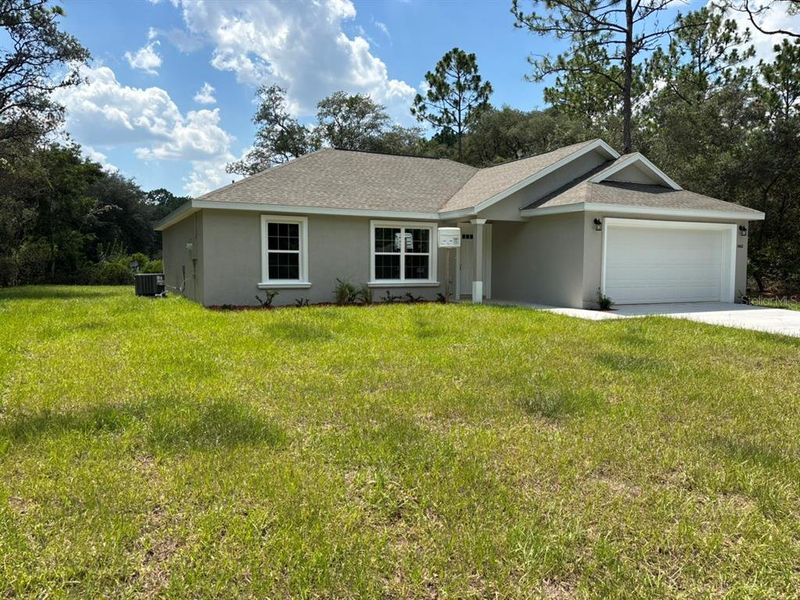 Front exterior of a new home in , Dunnellon, FL, highlighting curb appeal (Image 16). Front exterior of a new home in , Dunnellon, FL, highlighting curb appeal (Image 16).