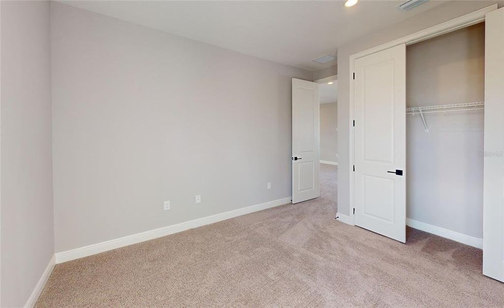Spacious, unfurnished interior of a new home in Laureate Park, Orlando (Image 25).