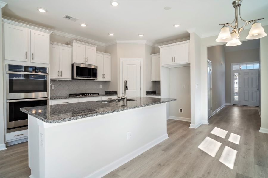 Representative furnished interior of a home built from the The Jasmine by Chesapeake Homes in Coastal Club of the Carolinas, Calabash (Image 6).