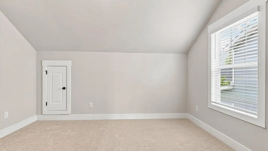 First-rate bedroom with plush carpeting and a large window that provide an open, airy feel at Walnut Ridge