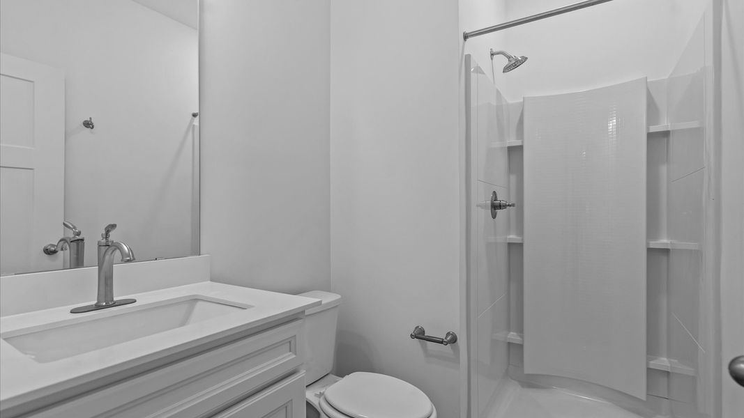 Refined hall bath with elevated finishes and a highly functional layout