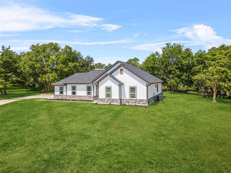 Front exterior of a new home in , Brenham, TX, highlighting curb appeal (Image 16). Front exterior of a new home in , Brenham, TX, highlighting curb appeal (Image 16).