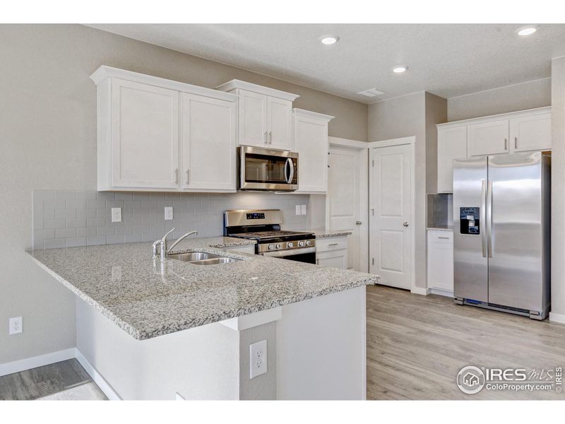 Furnished interior view inside a new home in Silver Peaks, Lochbuie (Image 6).