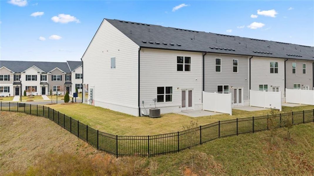 Exterior details and patio area of a home in Echo Glen, Stockbridge (Image 27).
