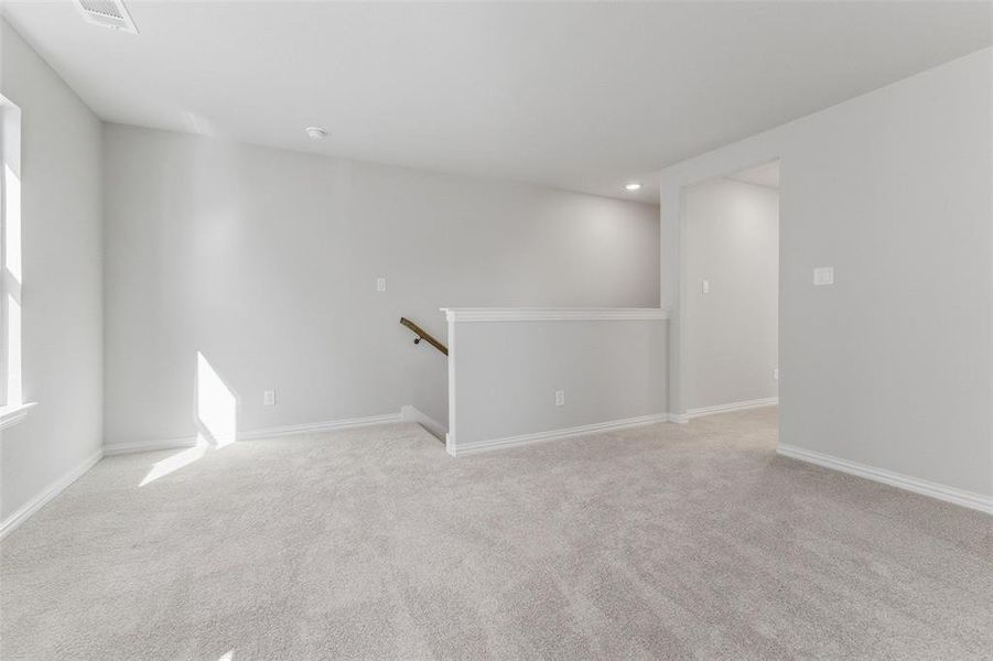 Unfurnished room featuring light colored carpet and recessed lighting