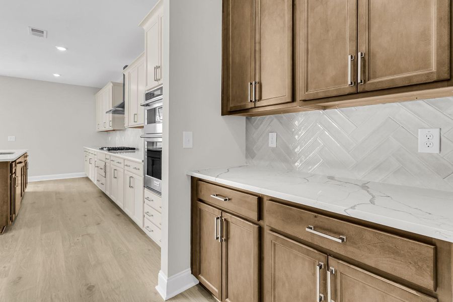 Furnished interior view inside a new home in Tidewater at Lakes of Cane Bay, Summerville (Image 10). Furnished interior view inside a new home in Tidewater at Lakes of Cane Bay, Summerville (Image 10).