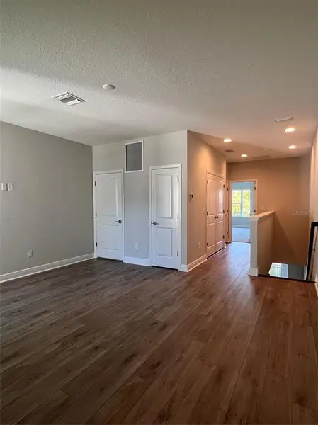 Spacious, unfurnished interior of a new home in The Towns At Long Bayou, Seminole (Image 13).