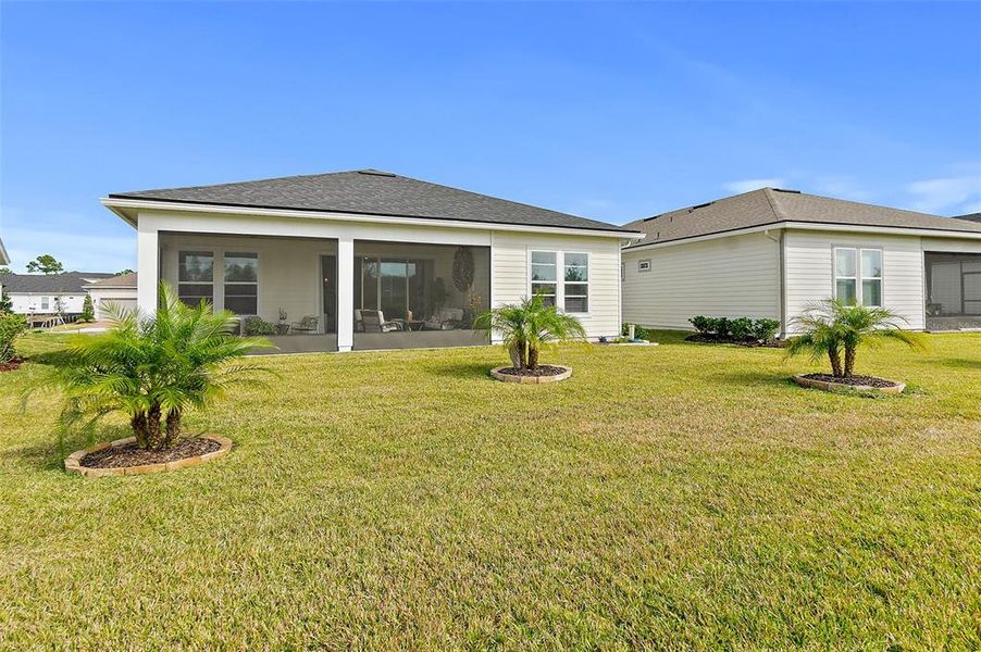 Exterior details and patio area of a home in Reverie at Palm Coast, Palm Coast (Image 25).