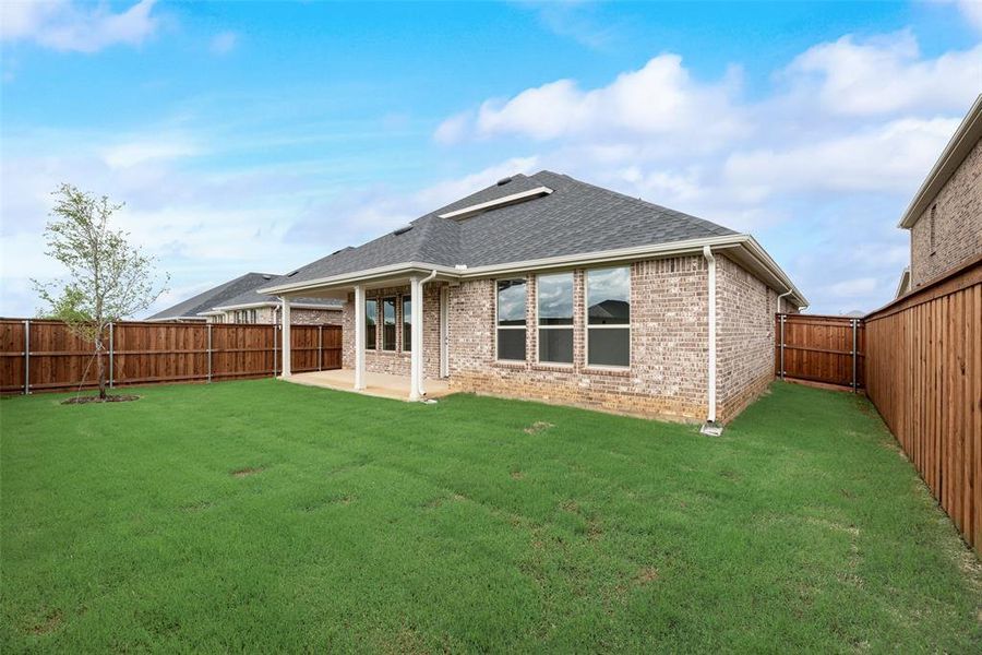 Exterior details and patio area of a home in Spiritas Ranch, Little Elm (Image 30). Exterior details and patio area of a home in Spiritas Ranch, Little Elm (Image 30).