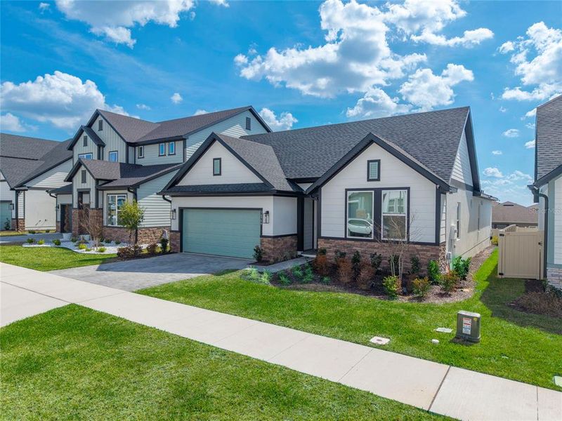 Front exterior of a new home in , Clermont, FL, highlighting curb appeal (Image 2). Front exterior of a new home in , Clermont, FL, highlighting curb appeal (Image 2).