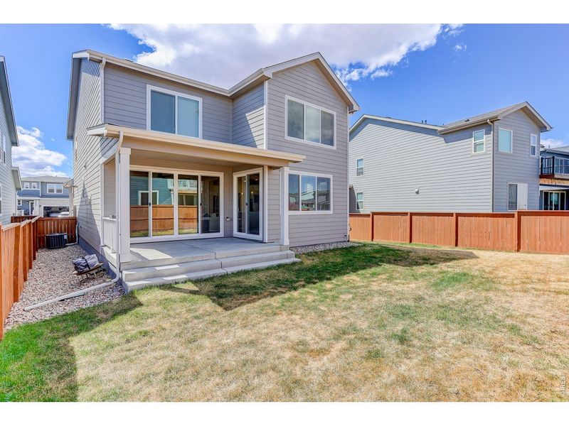 Exterior details and patio area of a home in Mountain Brook, Longmont (Image 29).