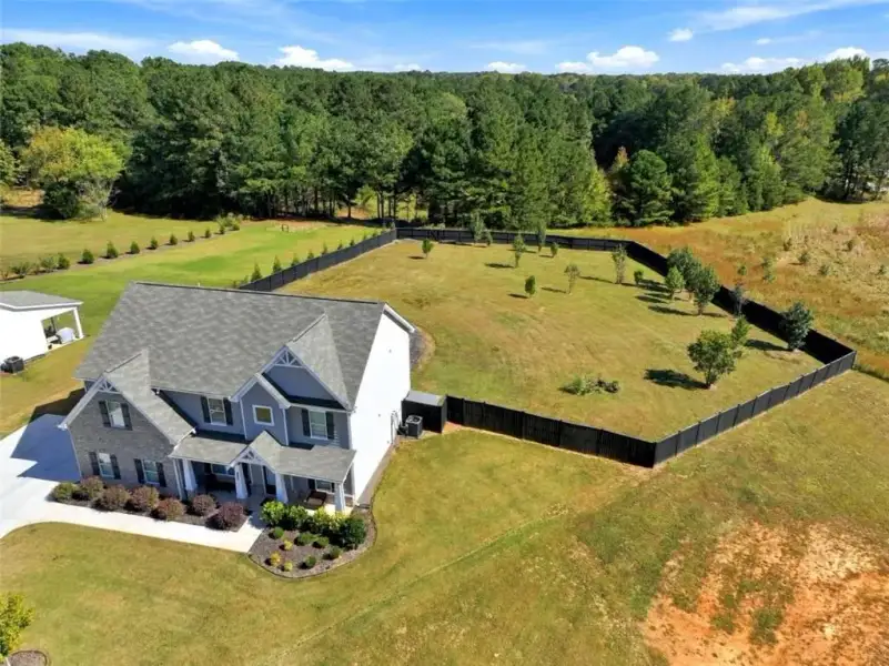 Front exterior of a new home in Joel's Landing, Monroe, GA, highlighting curb appeal (Image 25).