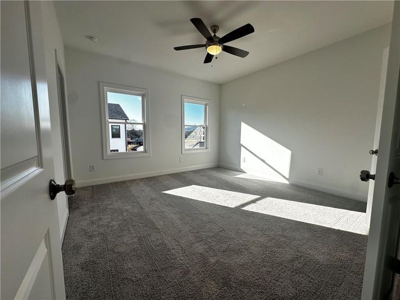 Gorgeous Owners Suite with Ceiling Fan and ample natural light