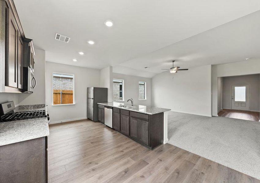 The kitchen has sprawling granite countertops.