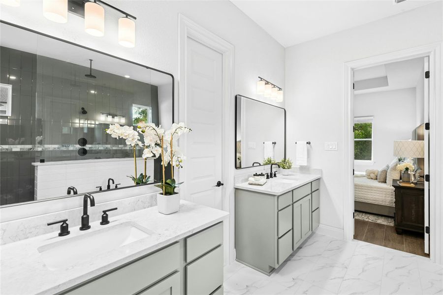 Full bathroom featuring two vanities Full bathroom featuring two vanities