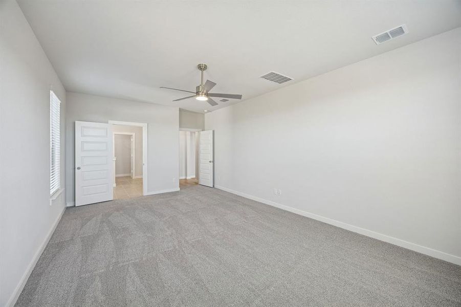 Primary Suite in the Wimbledon home plan by Trophy Signature Homes – REPRESENTATIVE PHOTO Primary Suite in the Wimbledon home plan by Trophy Signature Homes – REPRESENTATIVE PHOTO