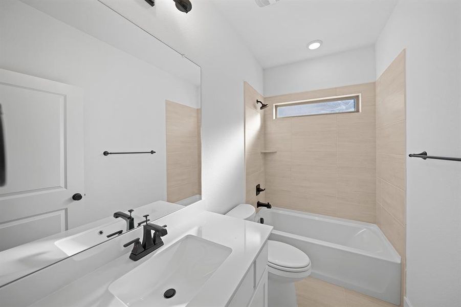 Full bathroom featuring vanity and shower / bath combination