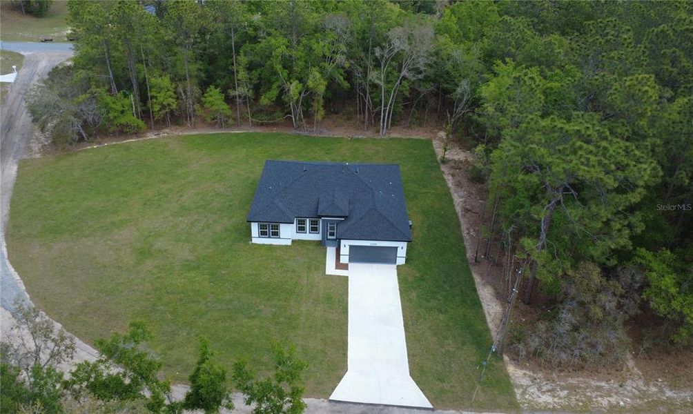 Front exterior of a new home in , Citrus Springs, FL, highlighting curb appeal (Image 15). Front exterior of a new home in , Citrus Springs, FL, highlighting curb appeal (Image 15).