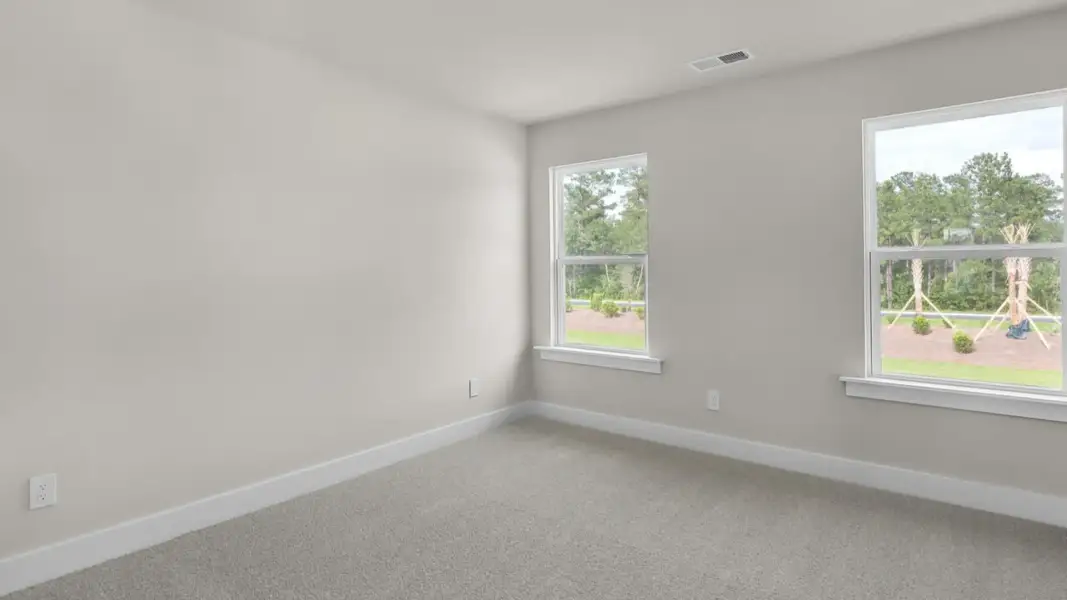 Representative unfurnished interior of a home built from the Forrester by D.R. Horton in The Highlands at Cedar Hill Landing, Navassa (Image 31).