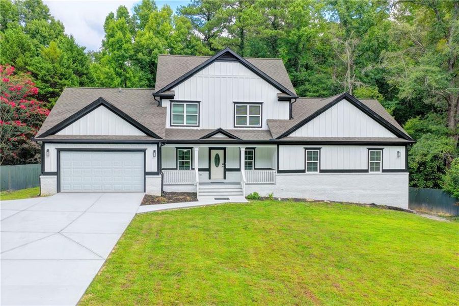 Front exterior of a new home in , Snellville, GA, highlighting curb appeal (Image 1). Front exterior of a new home in , Snellville, GA, highlighting curb appeal (Image 1).
