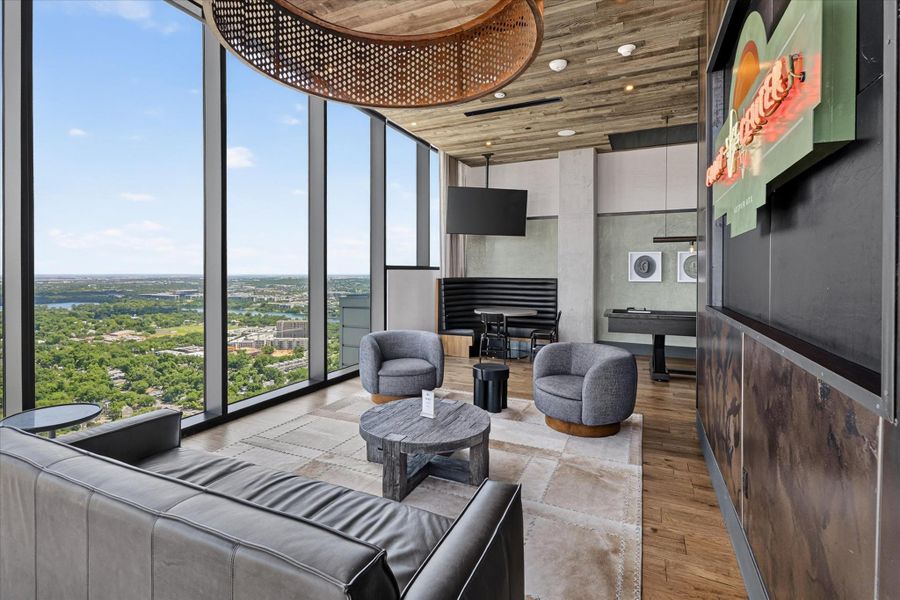 Floor-to-ceiling windows offer panoramic views in this elevated urban retreat.