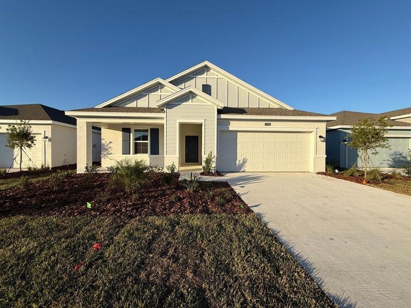 Front exterior of a new home in , Kissimmee, FL, highlighting curb appeal (Image 27).