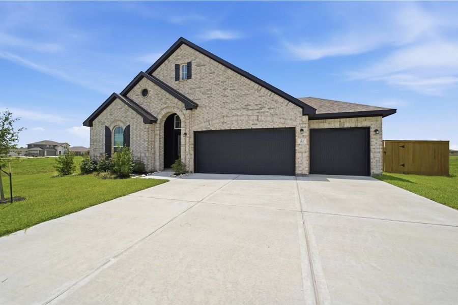 Front exterior of a new home in River Ranch Meadows, Dayton, TX, highlighting curb appeal (Image 2).