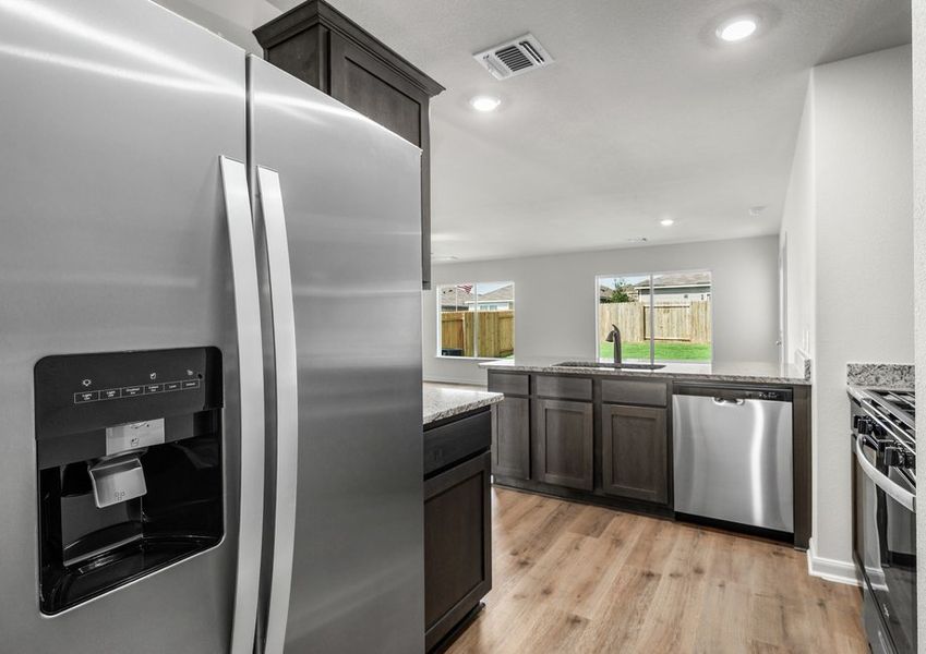 The kitchen has energy-efficient, stainless steel appliances.
