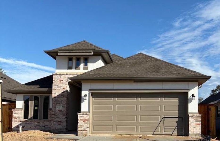 Front exterior of a new home in The Highlands 45', Porter, TX, highlighting curb appeal (Image 1).