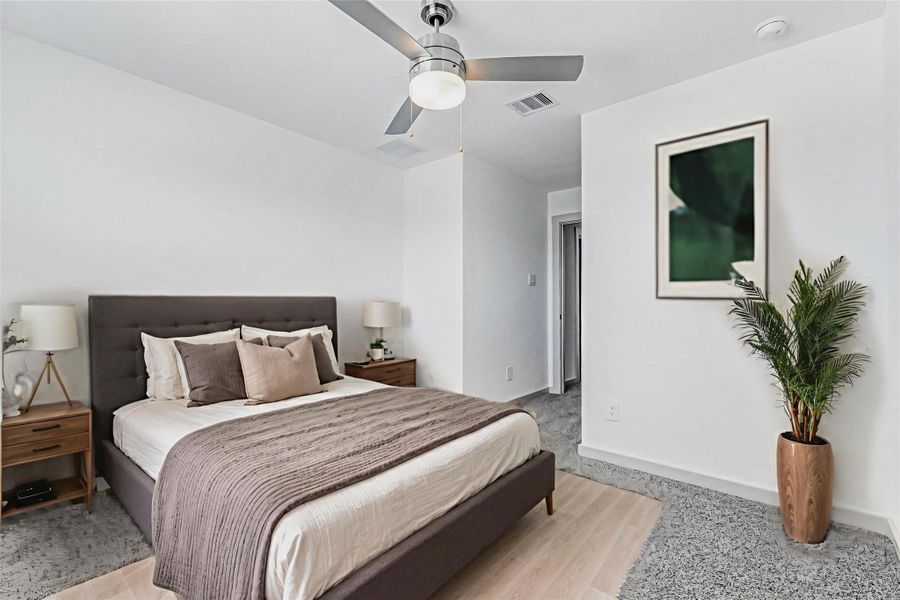 This spacious room offers ample natural light from two large windows, a modern ceiling fan, and vaulted ceilings for an added sense of space. A perfect setup for a bedroom, creative studio, or upper-level flex space. This spacious room offers ample natural light from two large windows, a modern ceiling fan, and vaulted ceilings for an added sense of space. A perfect setup for a bedroom, creative studio, or upper-level flex space.