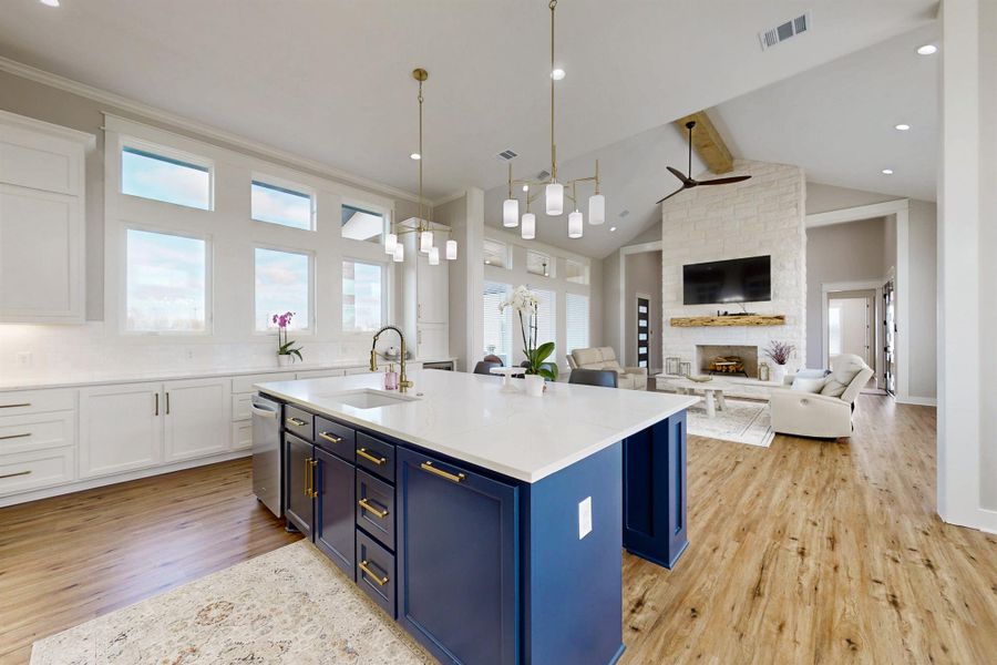 Gorgeous extensive cabinetry. But notice anything different? Wher is the oven and microwave? Those things are in the Butlers Pantry next to the kitchen, not In the kitchen. It is like having 2 kitchens. Entertain, serve and dine in the open kitchen, but keep the mess in the huge pantry. Dreamy!  The kitchen has a propane cook top, dishwasher, garbage disposal, one of 2 wine coolers, and refrigerator.