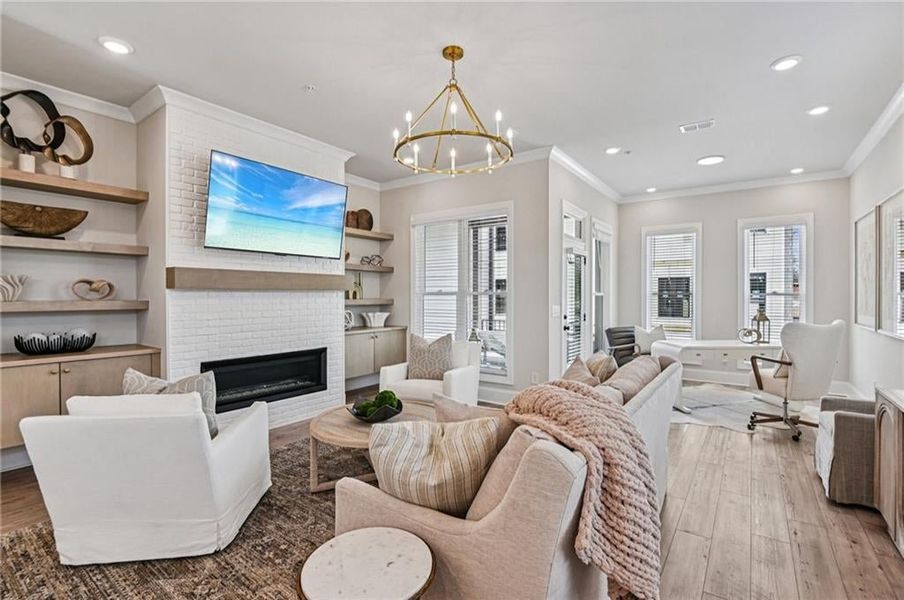 Beautifully designed and appointed finishes:  Gold accent fixtures, warm natural colors and painted brick fireplace surround