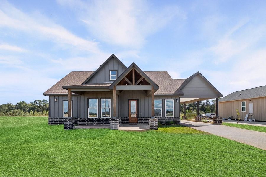 Charming single-story modern farmhouse on a large lot, highlighted by clean lines, gable accents, and inviting front porch—no back or left-side neighbors for exceptional privacy. Driveway under construction, picture virtually enhanced to demonstrate the final product. Charming single-story modern farmhouse on a large lot, highlighted by clean lines, gable accents, and inviting front porch—no back or left-side neighbors for exceptional privacy. Driveway under construction, picture virtually enhanced to demonstrate the final product.