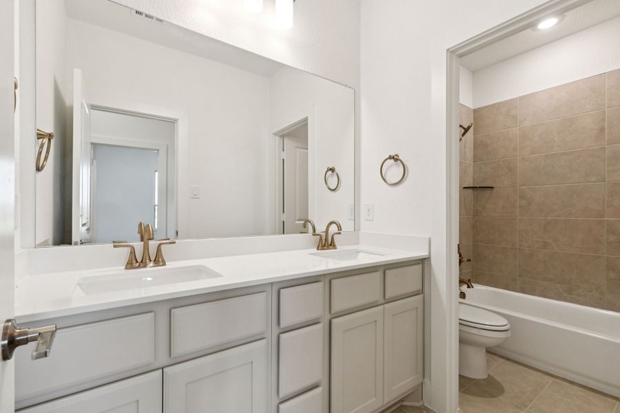 Representative furnished interior of a home built from the Halsted by Centre Living Homes in Lakeway Estates, Waxahachie (Image 12).