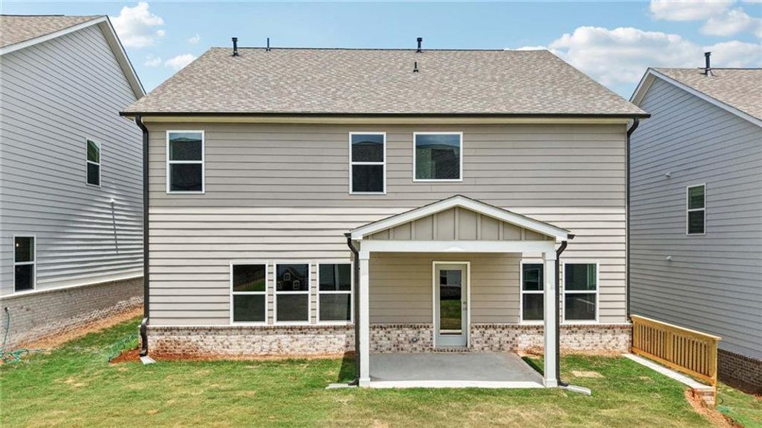 Exterior details and patio area of a home in Eastlyn Crossing, Flowery Branch (Image 3).