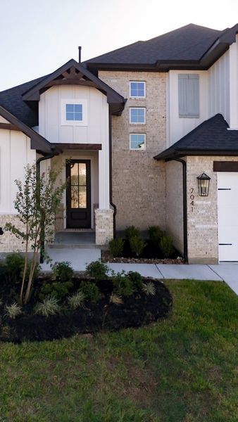 Front exterior of a new home in Stella Ranch, Bryan, TX, highlighting curb appeal (Image 24).
