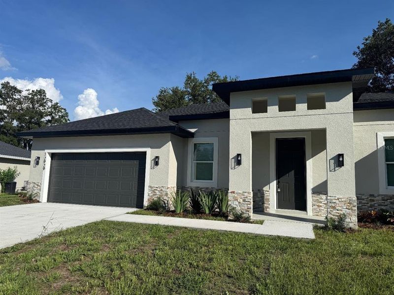 Front exterior of a new home in , Ocala, FL, highlighting curb appeal (Image 15).