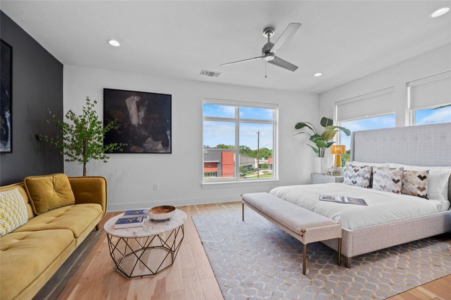 Spacious interior featuring wood-finish flooring, recessed lighting, and a modern ceiling fan