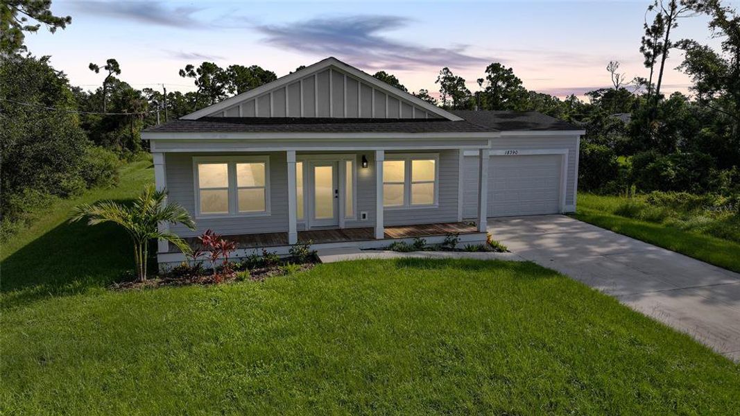 Front exterior of a new home in , Port Charlotte, FL, highlighting curb appeal (Image 21).